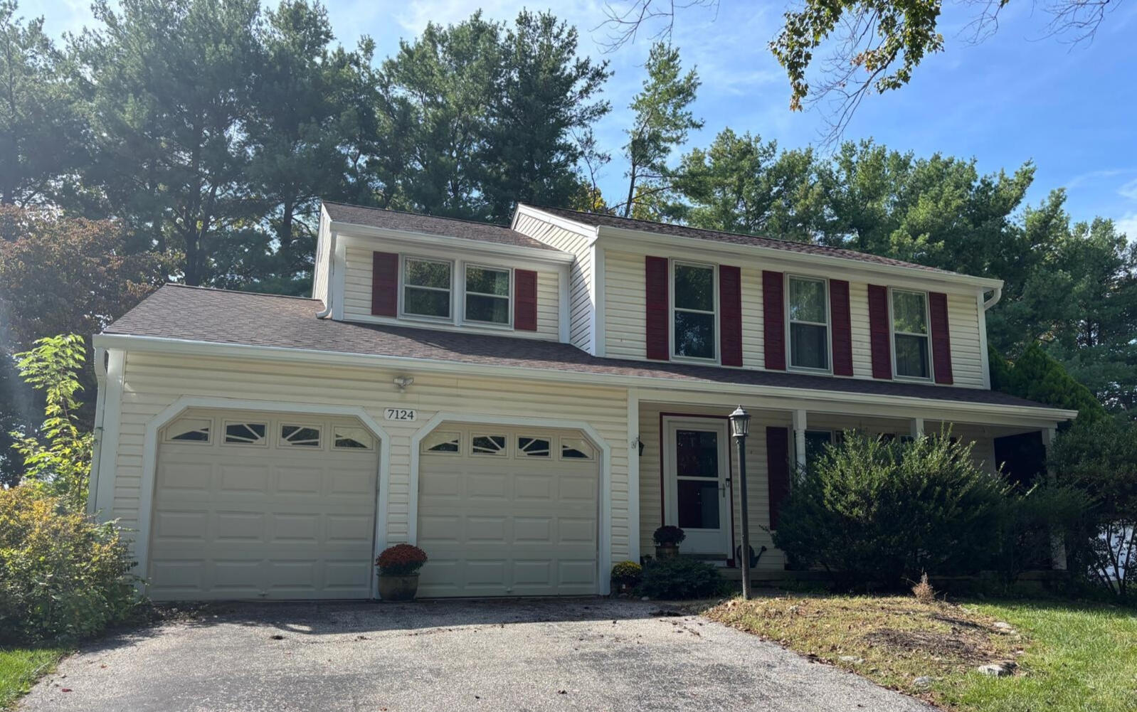 This Columbia, MD home features new 6-inch white seamless aluminum K-style gutters, matching downspouts, and Klear Micro Mesh gu White 6-inch seamless aluminum K-style gutters with Klear Micro Mesh gutter guards on a two-story home in Columbia, MD.